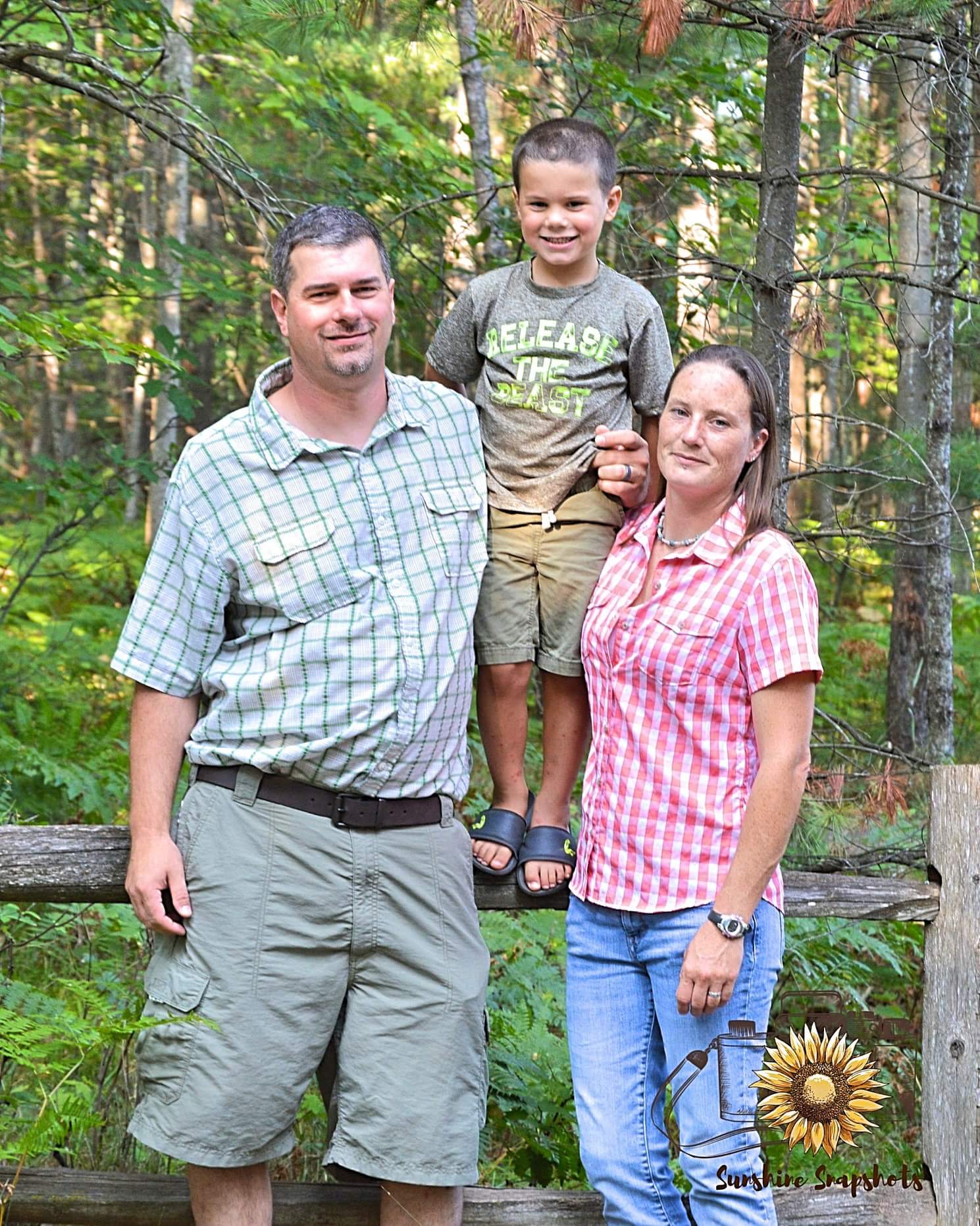 Corey, Sarah and Dylan Bohnsack family photo in Northern Michigan woods