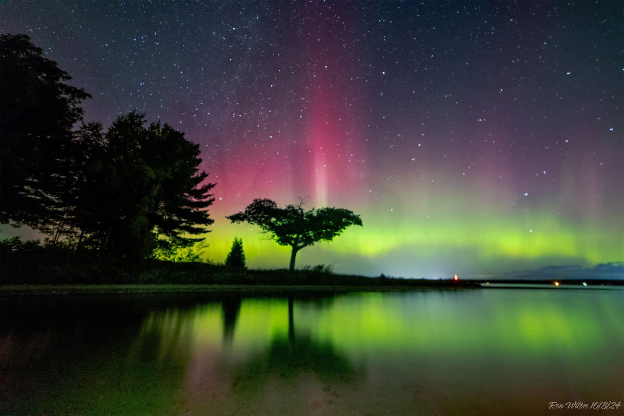 Higgins Lake Michigan sunrise with pontoon boat