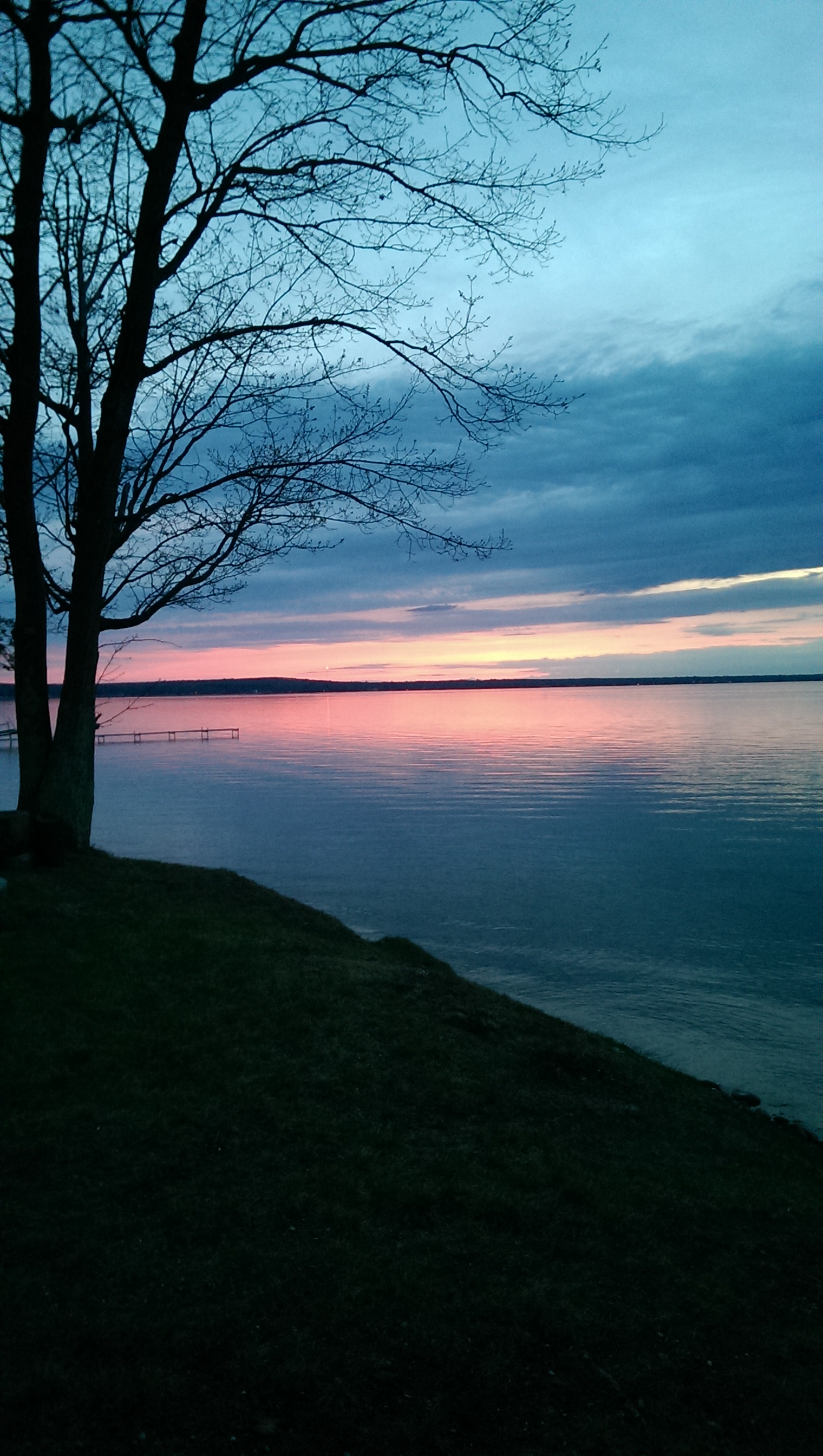Dock at sunset on Houghton Lake Michigan - vacation rental investment guide